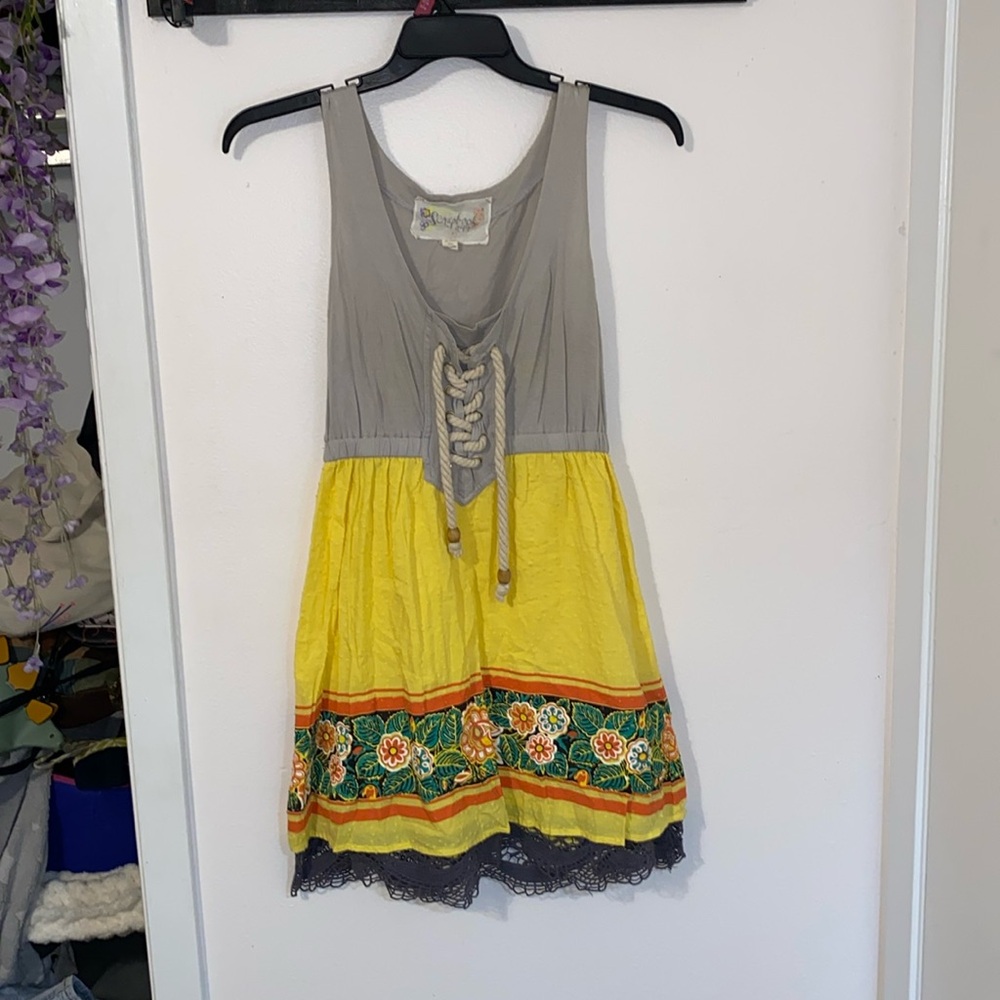 Small grey and yellow dress with flower designs and cord string